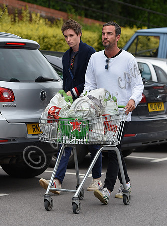 Eddie Redmayne wearing blue cardigan, skinny jeans and trainers on shopping trip to Stroud