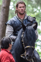 Chris Hemsworth on horseback with horse master alongside