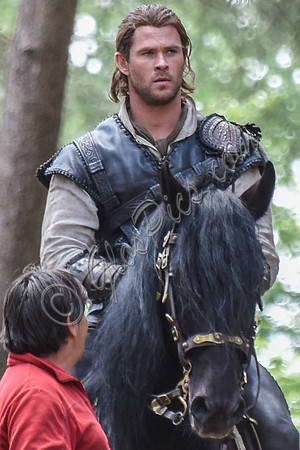 Chris Hemsworth on horseback with horse master alongside