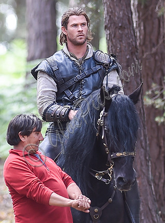 Chris Hemsworth on horseback with horse master alongside