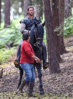 Chris Hemsworth on horseback with horse master alongside