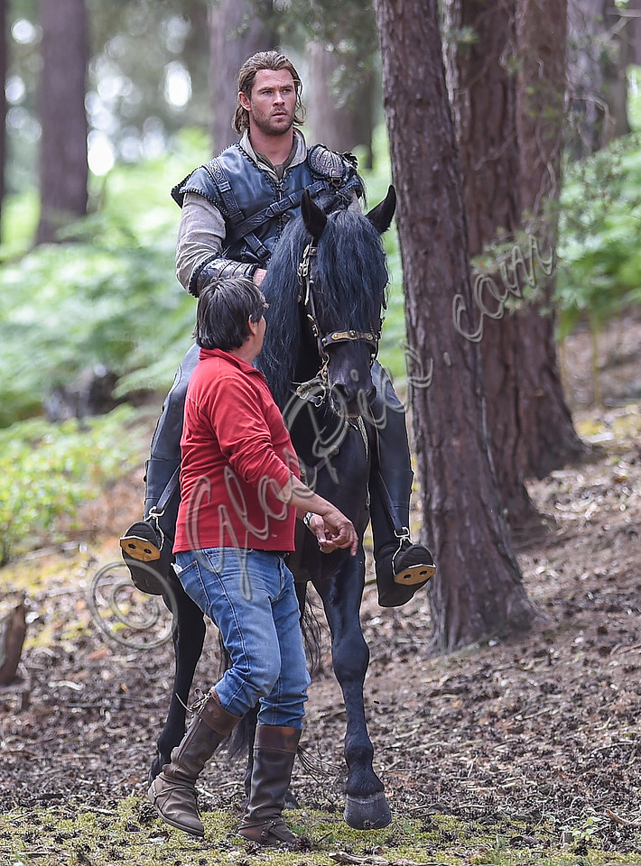 Chris Hemsworth on horseback with horse master alongside