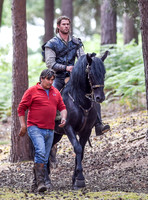 Chris Hemsworth on horseback with horse master alongside