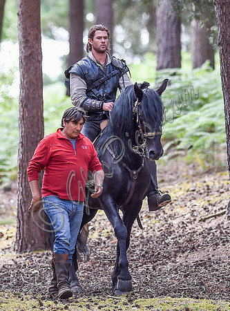 Chris Hemsworth on horseback with horse master alongside