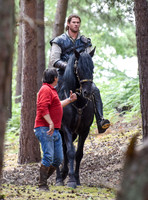 Chris Hemsworth on horseback with horse master alongside