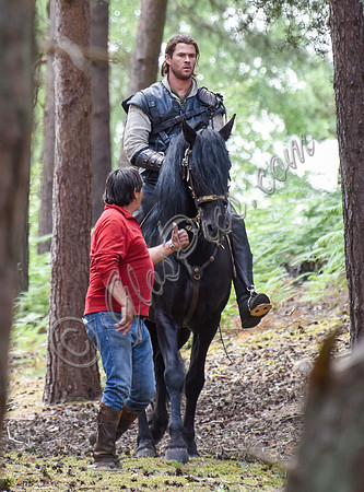 Chris Hemsworth on horseback with horse master alongside