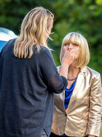 Ashley Jenson having make-up retouched with others