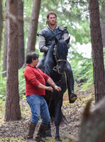 Chris Hemsworth on horseback with horse master alongside