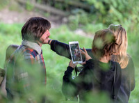 Character being photographed for continuity