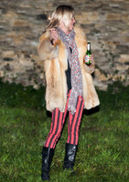 Kate  Moss with bottle of beer and a sparkler