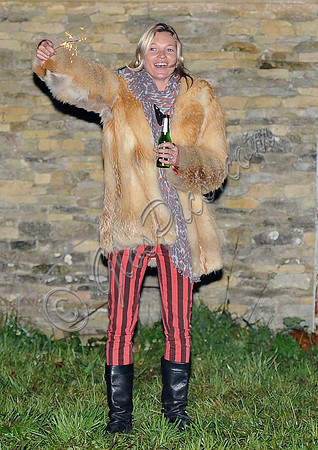 Kate  Moss with bottle of beer and a sparkler