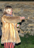 Kate  Moss with bottle of beer and a sparkler