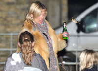 Kate Moss celebrates Guy Fawkes, with a bottle of Beck's beer and a sparkler