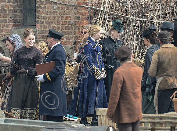 Mia Wasikowska  and cast filming scenes for "Alice in Wonderland" at Gloucester Docks