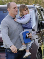 Mike Tindall carrying Mia Tindall