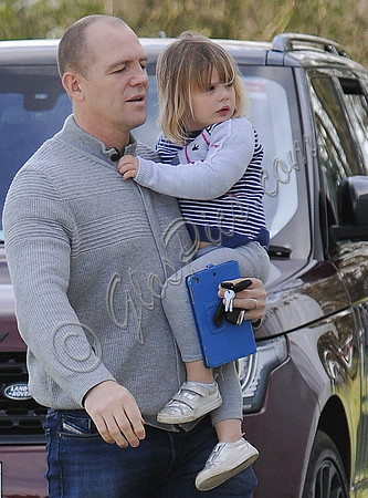 Mike Tindall carrying Mia Tindall