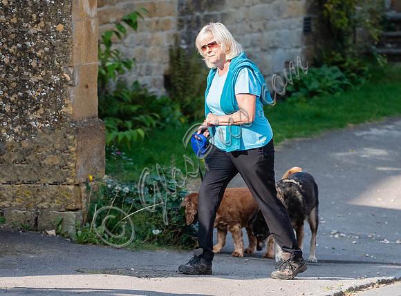 Former Tennis Star and quiz game host Sue Barker walking  her dogs