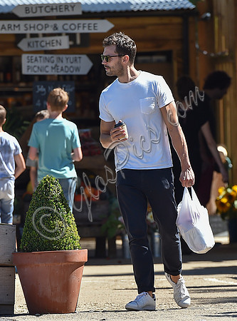 Jamie Dornan in white T shirt and Jeans