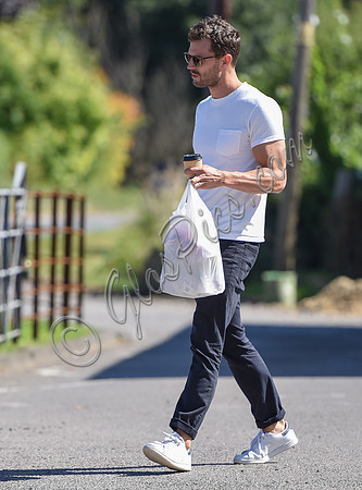 Jamie Dornan in white T shirt and Jeans