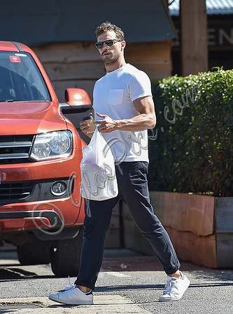 Jamie Dornan in white T shirt and Jeans