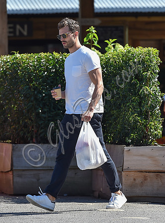 Jamie Dornan in white T shirt and Jeans
