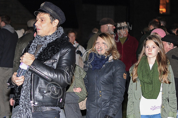 Jamie Hince casual all black look in leather biker jacket, engineer boots, skinny jeans wearing military style hat.