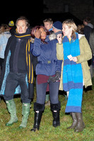 Kate Moss, John Hitchcox and Phoebe Vela looking casual at bonfire party.