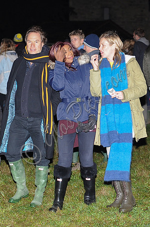 Kate Moss, John Hitchcox and Phoebe Vela looking casual at bonfire party.