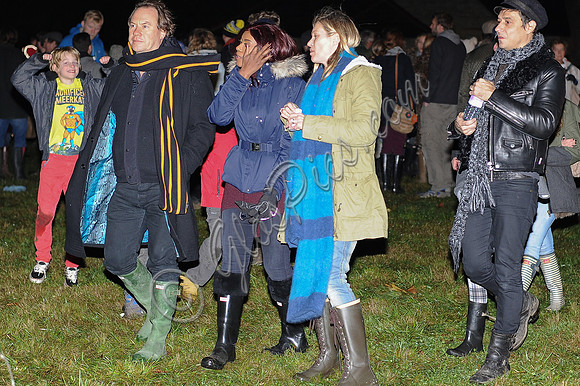 Kate Moss, John Hitchcox and Phoebe Vela looking casual at bonfire party.