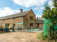 exterior building views of Beckham's triple barn conversion