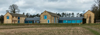exterior building views of Beckham's triple barn conversion