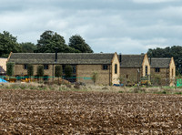 exterior building views of Beckham's triple barn conversion