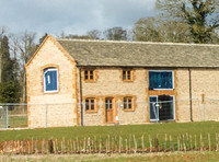 exterior building views of Beckham's triple barn conversion