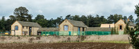 exterior building views of Beckham's triple barn conversion