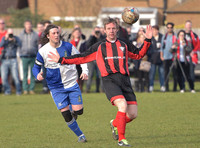 Stuart 'Psycho' Pearce for Longford AFC arms outstretched, ball in air v Wotton Rovers player with long hair wearing black headband