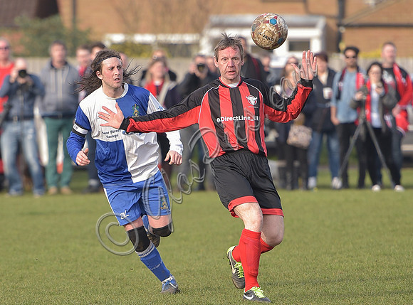 Stuart 'Psycho' Pearce for Longford AFC arms outstretched, ball in air v Wotton Rovers player with long hair wearing black headband