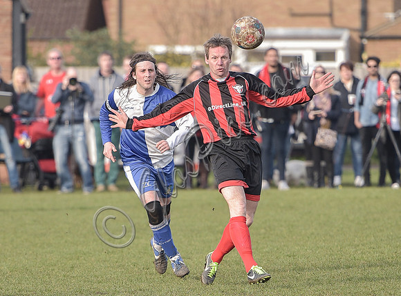 Stuart 'Psycho' Pearce for Longford AFC, arms outstretched  with ball near head v Wotton Rovers player, long hair with headband