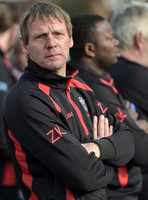 Stuart 'Psycho' Pearce for Longford AFC wearing team tracksuit, arms folded looking towards camera
