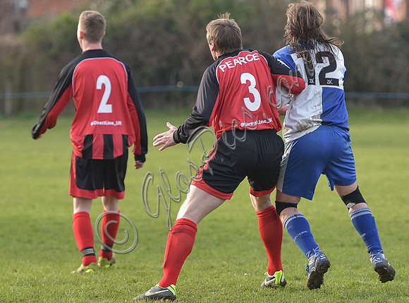 Back shot Stuart 'Psycho' Pearce No. 3 shirt with No 2 player for Longford AFC v Pearce grabbing arm of Wotton Rovers player with long hair wearing black headband