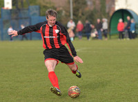 Stuart 'Psycho' Pearce for Longford AFC just about to kick ball direct at camera, crowd in background
