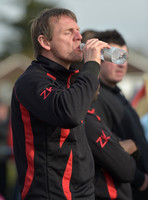 Stuart 'Psycho' Pearce for Longford AFC wearing team tracksuit drinking water from bottle,