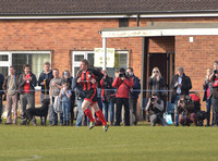 Stuart 'Psycho' Pearce running out onto the pitch as sub for Longford AFC , supporters and photographers watching from pitchside.