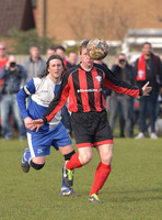 Stuart 'Psycho' Pearce for Longford AFC arms outstretched, ball partially blocking face v Wotton Rovers player with long hair wearing black headband