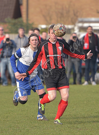 Stuart 'Psycho' Pearce for Longford AFC arms outstretched, ball partially blocking face v Wotton Rovers player with long hair wearing black headband