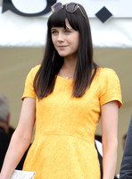 Lilah Parsons wearing bright yellow mini dress