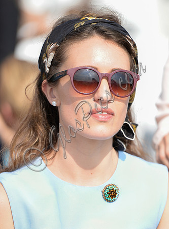 close up of atractive female wearing pretty brooch, headband and sunglasses