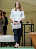 Cara Theobold wearing white top and blue trousers