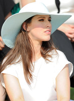 Laura Jackson wearing white dress and a wide brimmed hat