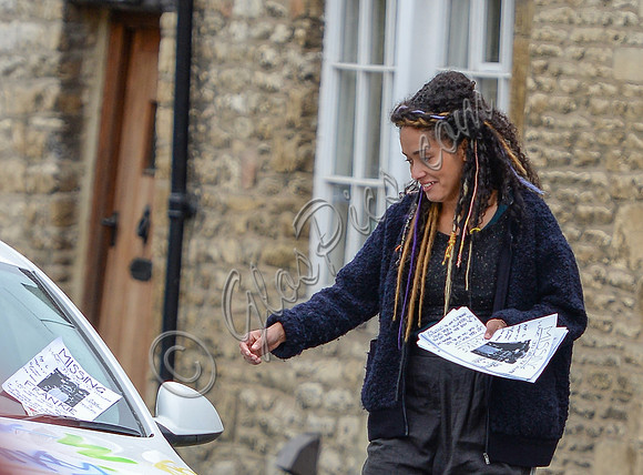 Karla Crome posting notices to find her missing daughter
