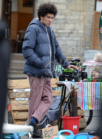 Joel Fry filming a market scene in "Apocalypse Slough"